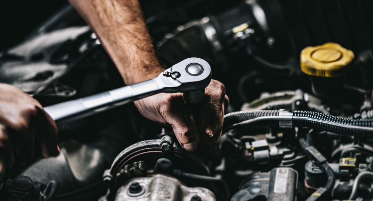 mechanic working on car